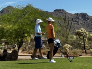 addy and her coach rob rashell on a golf course as addy prepares for the southwestern amateur