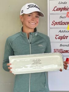 addy taylor smiles and holds the white trophy as the winner of the 2025 desert mountain ladies club championship