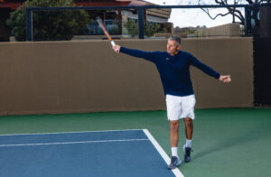 rich slivocka, director of racquet sports at desert mountain club in scottsdale returns a serve on a tennis court