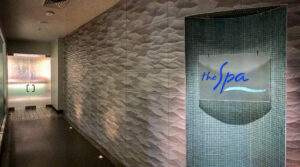 exterior shot of the spa at desert mountain club, showing light tiled walls mixed with light blue tiles