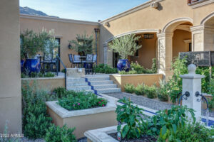 backyard garden with lush green plants at a desert mountain club home