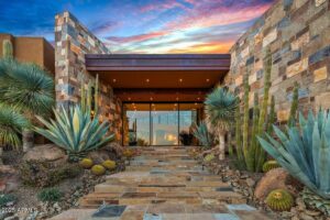 luxury front door at desert mountain club that is floor to ceiling glass