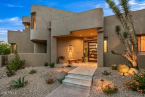 luxury front door at desert mountain club in scottsdale arizona built with wooden beams and glass
