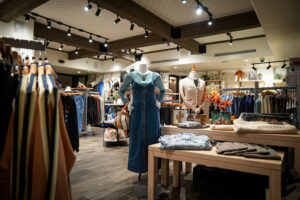 wide view of the boutique at dm displaying clothing and wellness products for members